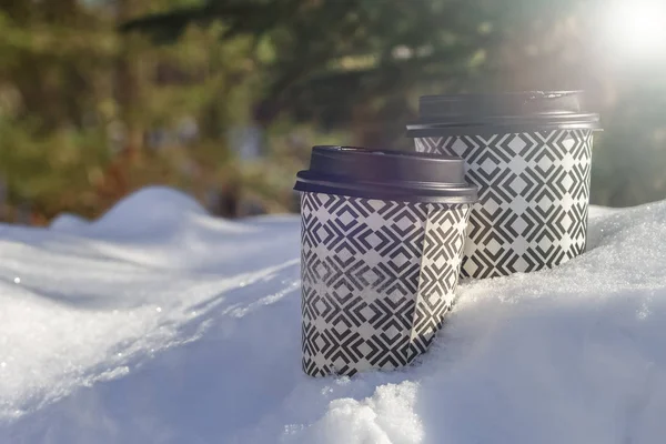 Two Takeaway Coffee Cup on the winter background
