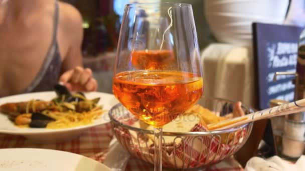 Woman eating pasta with seafood — Stock Video