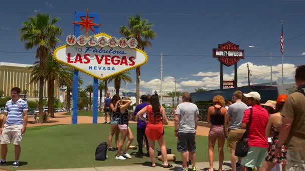 Tourists near Las Vegas sign — Stock Video