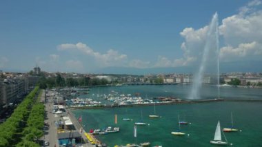 Day time 4k footage of Geneva aerial riverscape panorama with huge fountain, Switzerland  