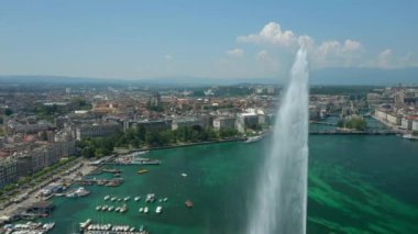 Day time 4k footage of Geneva aerial riverscape panorama with huge fountain, Switzerland  