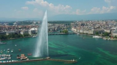 Day time 4k footage of Geneva aerial riverscape panorama with huge fountain, Switzerland  