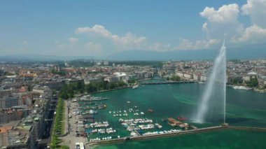 Day time 4k footage of Geneva aerial riverscape panorama with huge fountain, Switzerland  