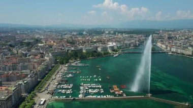 Day time 4k footage of Geneva aerial riverscape panorama with huge fountain, Switzerland  