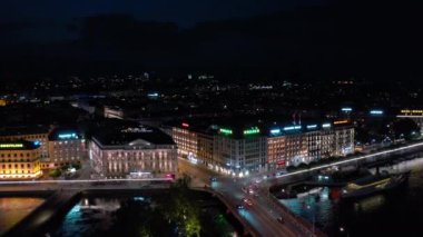 Night time 4k footage of illuminated Geneva cityscape panorama, Switzerland  