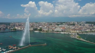 Day time 4k footage of Geneva aerial riverscape panorama with huge fountain, Switzerland  