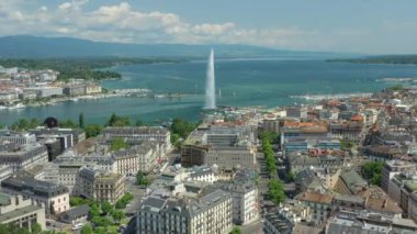 Day time 4k footage of Geneva aerial riverscape panorama with huge fountain, Switzerland  