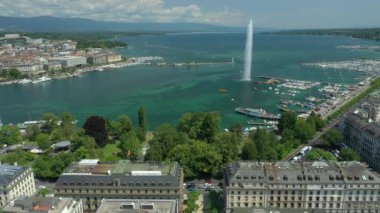 Day time 4k footage of Geneva aerial riverscape panorama with huge fountain, Switzerland  