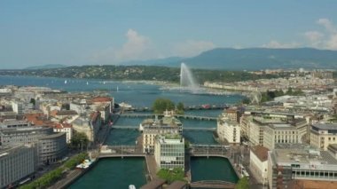 Day time 4k footage of Geneva aerial riverscape panorama with huge fountain, Switzerland  