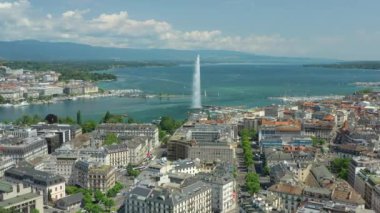 Day time 4k footage of Geneva aerial riverscape panorama with huge fountain, Switzerland  