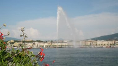 Day time 4k footage of Geneva aerial riverscape panorama with huge fountain, Switzerland  