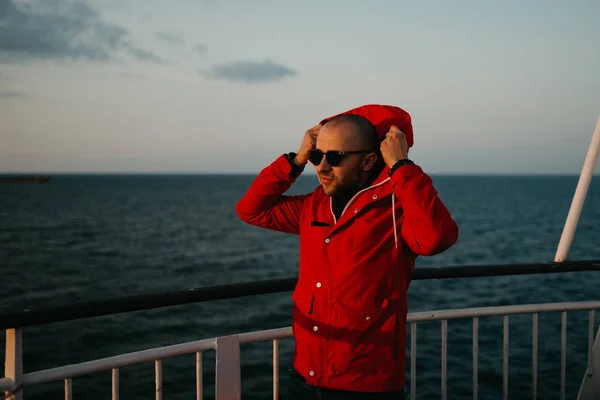 Bald Man Stubble Red Jacket Sunglasses Puts Hood His Head — 스톡 사진
