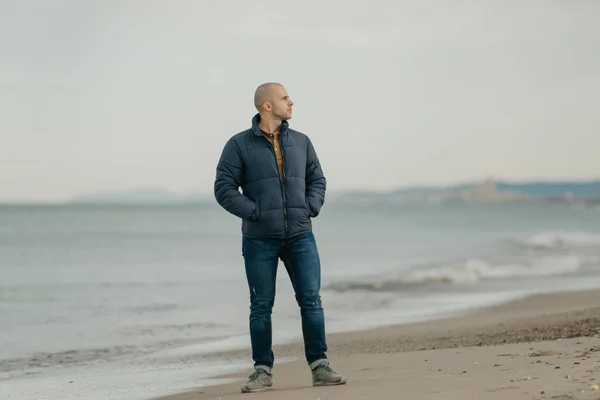 Muscular Bald Man Jeans Bologna Jacket Sneakers Poses Hands Pockets — 스톡 사진