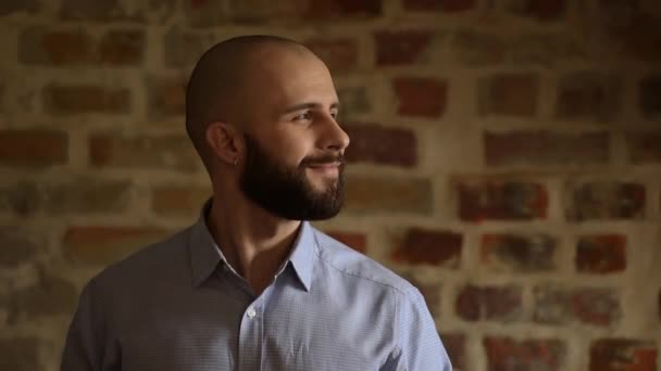 Bald Businessman Beard Looks Right Smiles Brick Wall Background Man — 图库视频影像