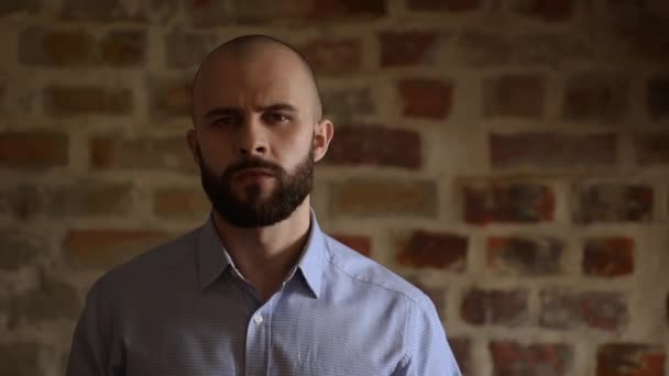 Bald Office Worker Turns His Head Smiles Brick Wall Background — Stockvideo