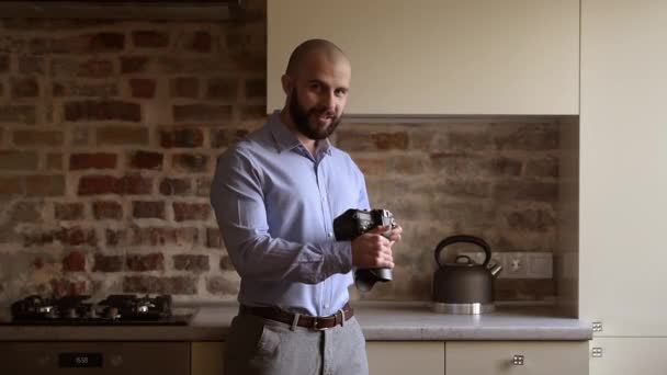 Happy Bald Photographer Searches Some Preferences His Camera Looks Straight — Wideo stockowe