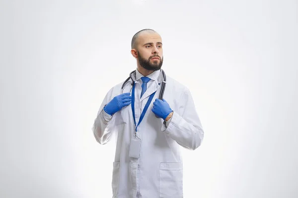 Doctor Holding Stethoscope Disposable Medical Gloves Bald Physician Beard Preparing — Stock Photo, Image