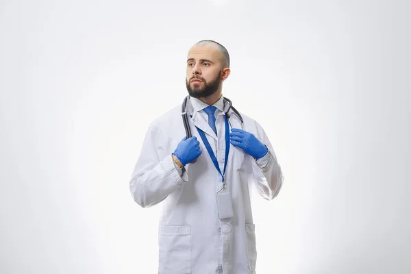 Doctor Holding Stethoscope Disposable Medical Gloves Bald Physician Beard Preparing — Stock Photo, Image