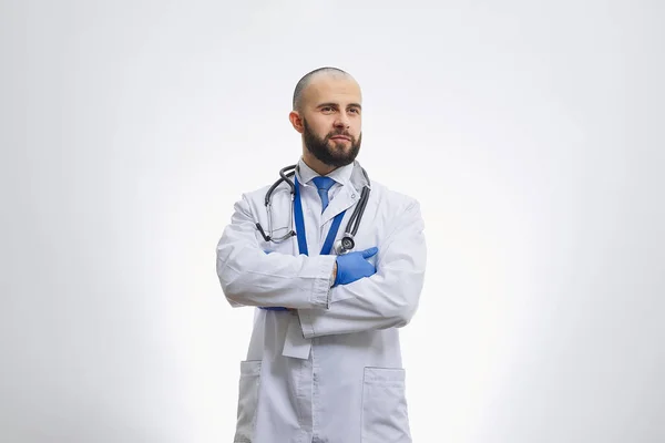 Serious Doctor Arms Crossed His Chest Disposable Medical Gloves Stethoscope — Stock Photo, Image