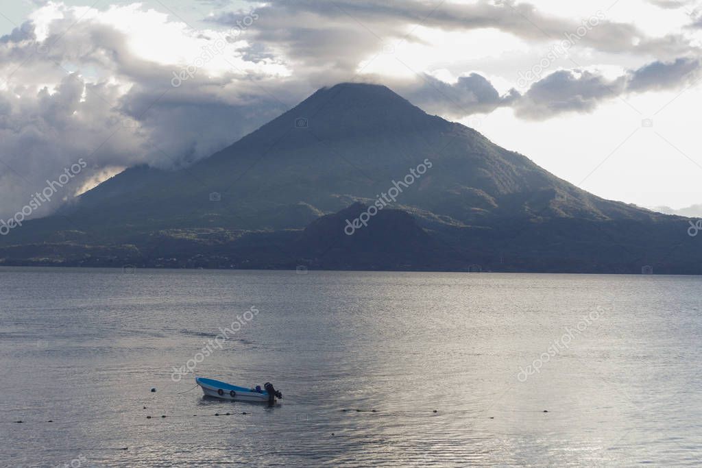 Sunset at lake of atitlan Guatemala - cloudy day at Panajachel Solola - Lake surrounded by mountains and volcanoes