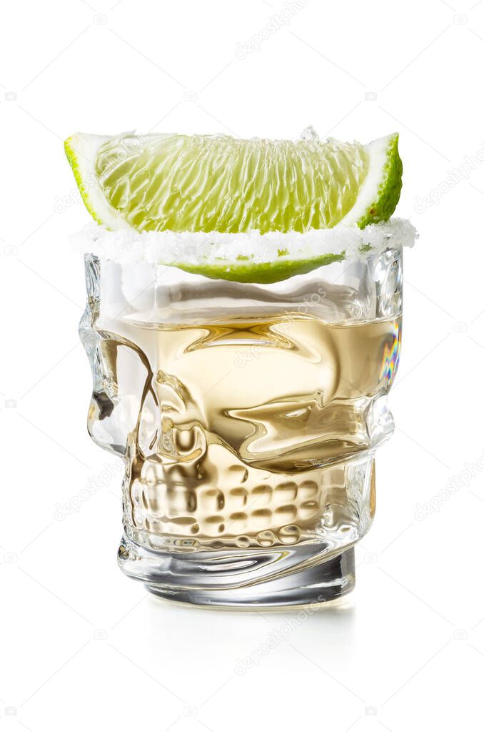 Skull Shaped Gold Tequila Glass Shot With Lime Slice and Salty Rim, Isolated on White Background With Clipping Path