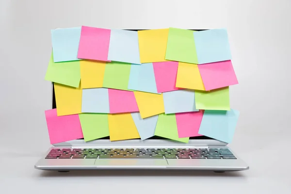 Colorful sticky memos covering a laptop screen — Stock Photo, Image