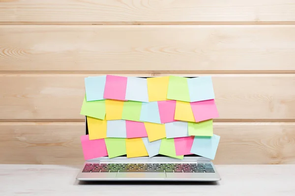 Collection of colorful sticky memos on a laptop — Stock Photo, Image