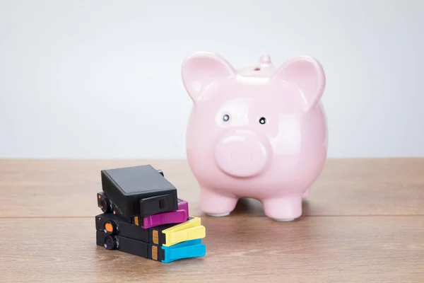 Ping piggy bank with empty printer ink cartridges
