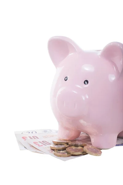 Pile of cash money with a pink piggy bank — Stock Photo, Image