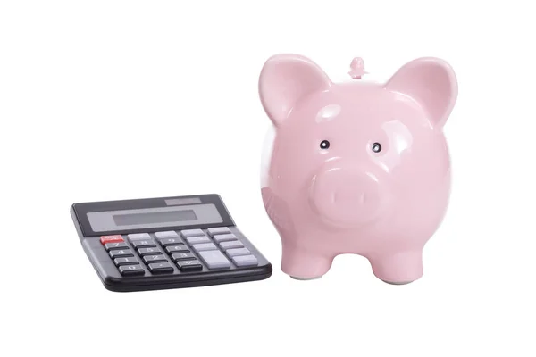 Calculadora com o banco piggy rosa no branco — Fotografia de Stock