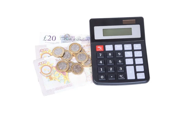 Pile of loose UK money with a calculator