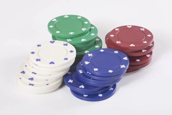 Four stacks of different colored casino chips — Stock Photo, Image