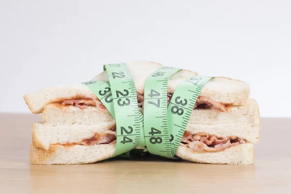 Tasty fresh meat sandwich wrapped in a tape