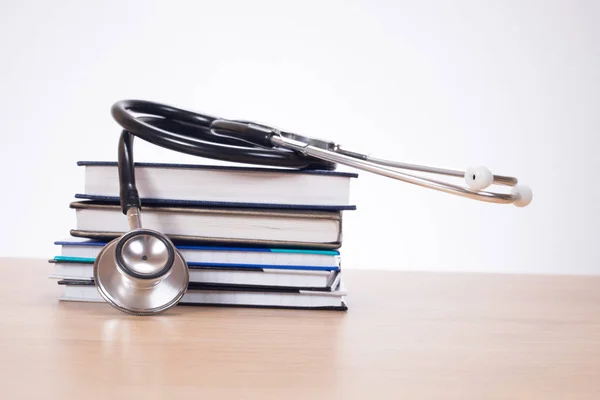Stethoscope on pile of journals — Stock Photo, Image