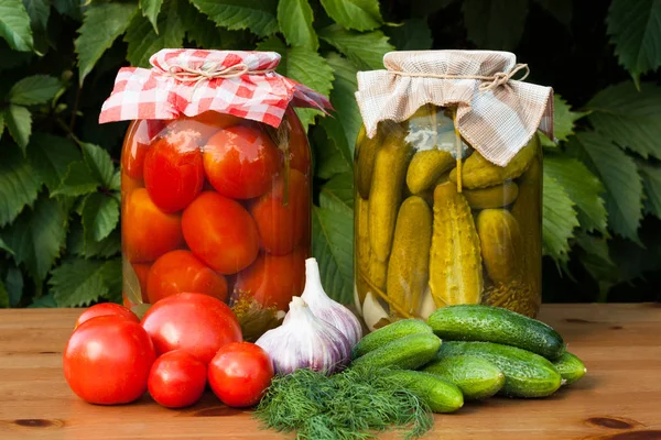 Canned Tomatoes And Pickled Cucumbers