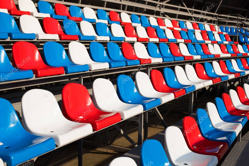 Empty Plastic Chairs In Stadium.