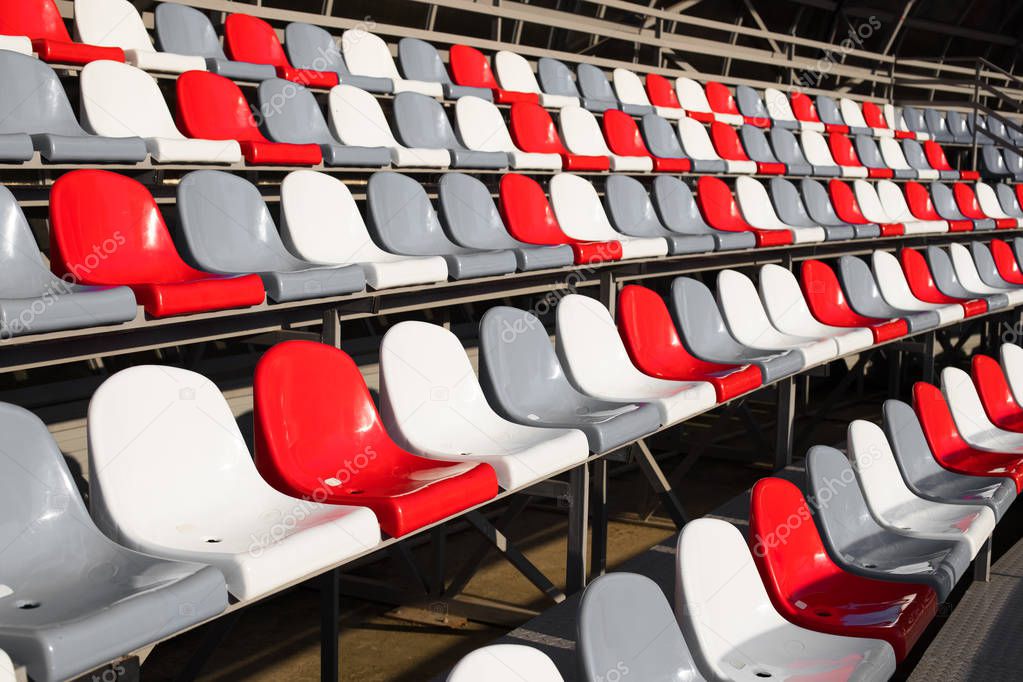Empty Plastic Chairs In Stadium.