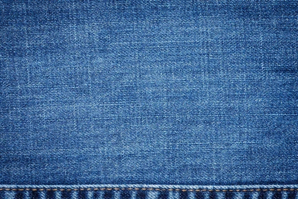 Cerrar Tejido azul Jeans con costuras externas . —  Fotos de Stock