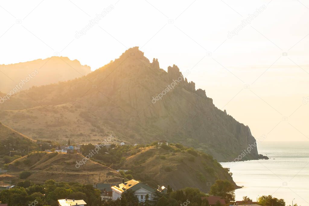 Scenic View On Kara Dag Mountain In Kurortnoe Settlement At Sunset Or Sunrise In Summer Crimea, Ukraine.