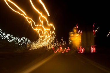 Road Movement In Dark Time At Night. Colorful Illumination Lamps