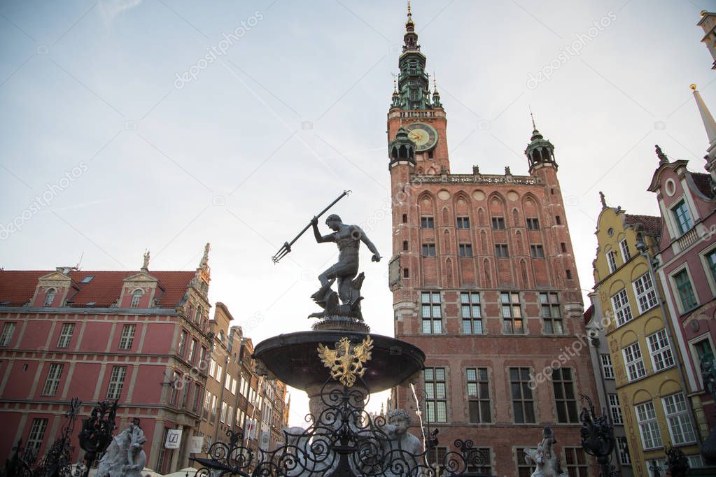 Fountain of the Neptune in old town of Gdansk, Main City Hall and Dlugi Targ Square in the city center, a famous historical landmark, Poland