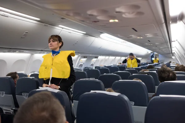 Safety briefing on board an aircraft — Stock Photo, Image