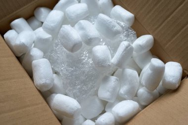 Streamlined polystyrene pieces inside the mail package. clipart