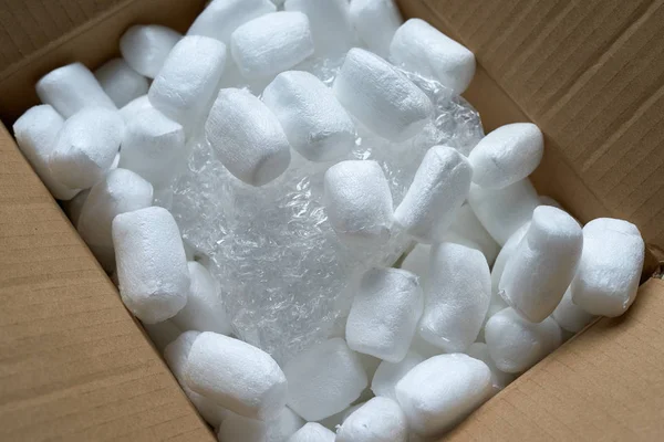 Streamlined polystyrene pieces inside the mail package.