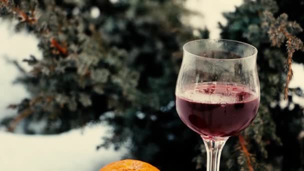 A glass of wine and an orange. — Stock Video