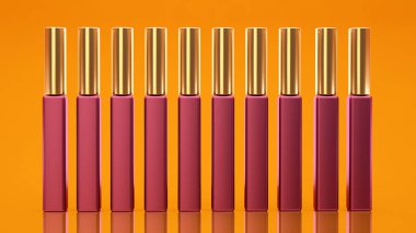 Sarı arka plan ile dudak parlatıcısı. Kozmetik, güzellik, moda, anne