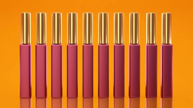 Sarı arka plan ile dudak parlatıcısı. Kozmetik, güzellik, moda, makyaj, makyaj, ruj.