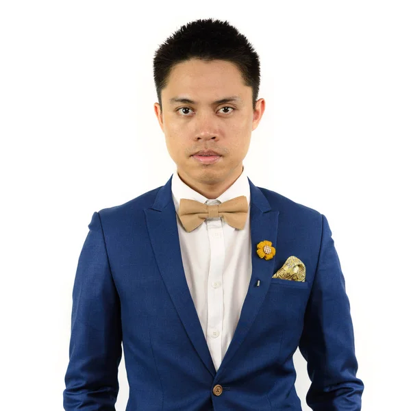 Asijské muž v modrém obleku motýlek, brož Stock Obrázky