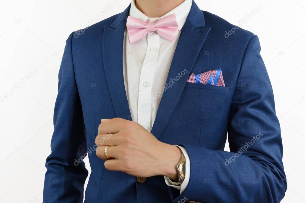 man in blue suit bowtie, pocket square