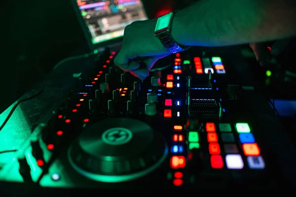 Hand of DJ controlling and moving the mixers in music remote — Stock Photo, Image